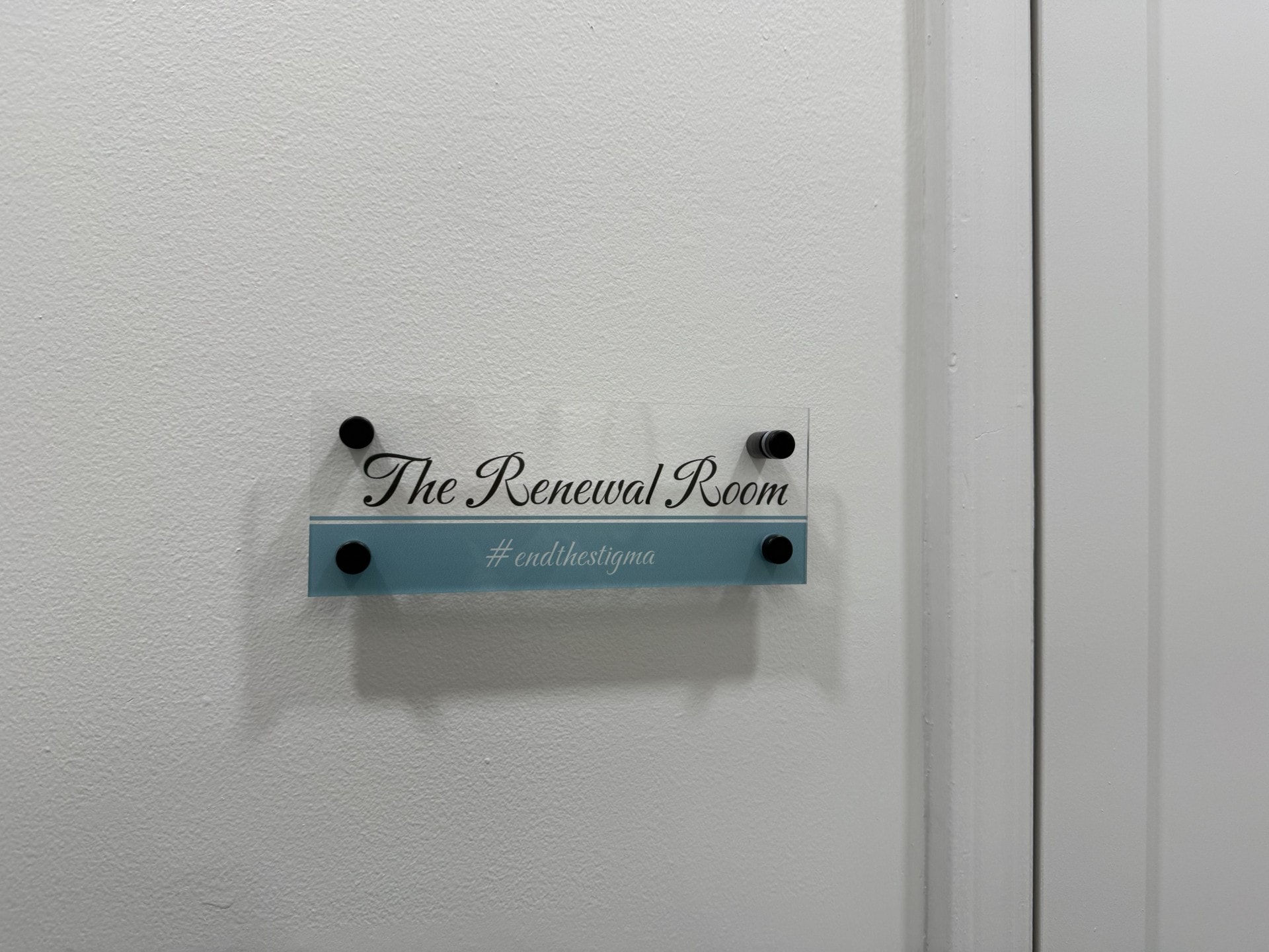 The Renewal Room door sign with #endthestigma